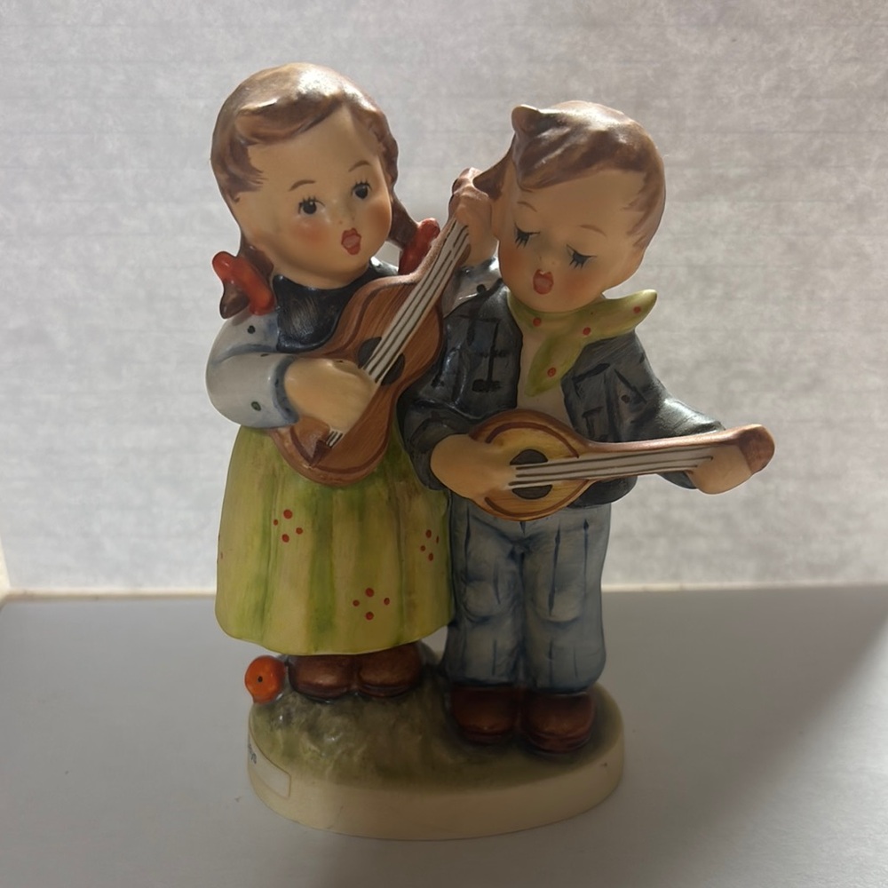 Charming Figurine of Children Playing Instruments